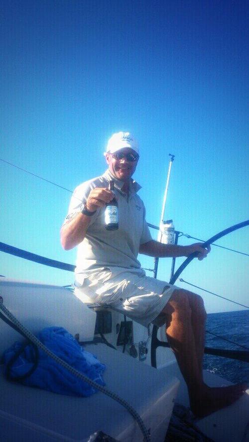 Andrew Reid on Django enjoying a Sunday afternoon beer. Photo by Andy Pilcher © Suellen Hurling